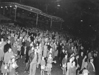 010783D: Crowd attending fireworks display, 1953