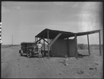 Stuart Gore and car by water tanks