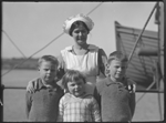 111013PD: Orphans Harry, Dorothy and Fred Gibbons with a nurse on the SS Benalla at Fremantle during their voyage to family in England, 1924