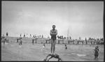 111689PD: Show of strength, Ted Monson (boxer and lifesaver) at South Beach, 1923
