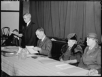 Mr S. N. McKenzie general secretary of the Red Cross Society (W.A. Division) reading the presidential address at the annual meeting, 26 September 1945 [picture]