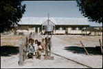 134349PD: L-R Back: Hillary Nelly, ?, Peter Dempster, Rossy Williams; Front: David Dempster, unknown girl at Gnowangerup Mission, January 1958. Nursery dormitory