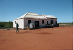 Unidentified building in Broome with gas tanks & 44-gallon drums outside