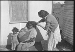 Betty McKeich cuts Margie Watson's hair at Cundeelee [picture]