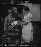 Giving alumiunium to scout, 1942