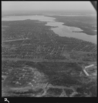 360597PD: Looking north over Bullcreek across Leach Highway to Brentwood. Noalimba Migrant Hostel is bottom left and Air Force Memorial Estate Homes for the Aged to the bottom right, 1974.