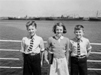 005081D: Two boys and a girl at the ships rail, 1950