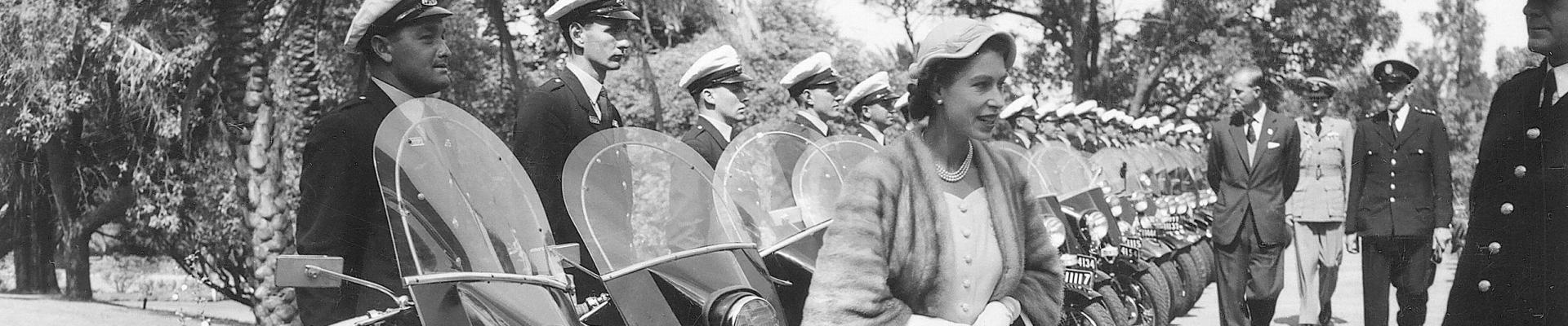 Royal visit inspecting motorcycle police escort 1954