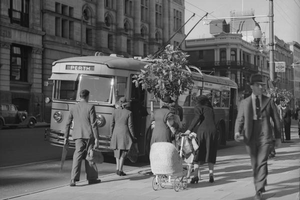 A trolley bus at a stop in St Georges Terrace c1950