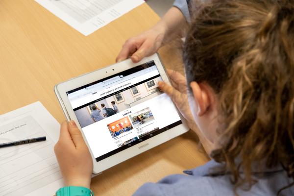 Child looking at library website on an ipad