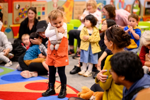 Story Time with child hugging toy