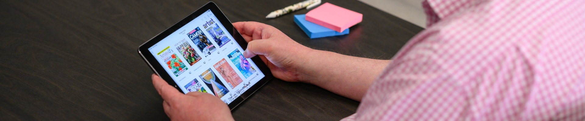 looking at magazines on a smart device