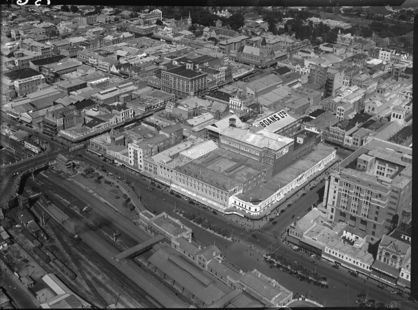 Aerial photograph looking south east across Perth Wellington Street Forrest Place Perth Railway Station Boans Ltd side of General Post Office Bairds building at bottom right and  Barrack Street Bridge at centre left