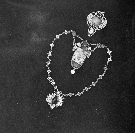 Photograph of a necklace and brooch by Gordon Holdsworth ca 1955